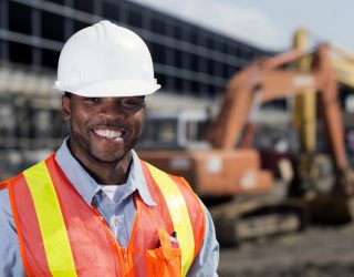 An image from the agriculture industry of a construction worker at a building site.